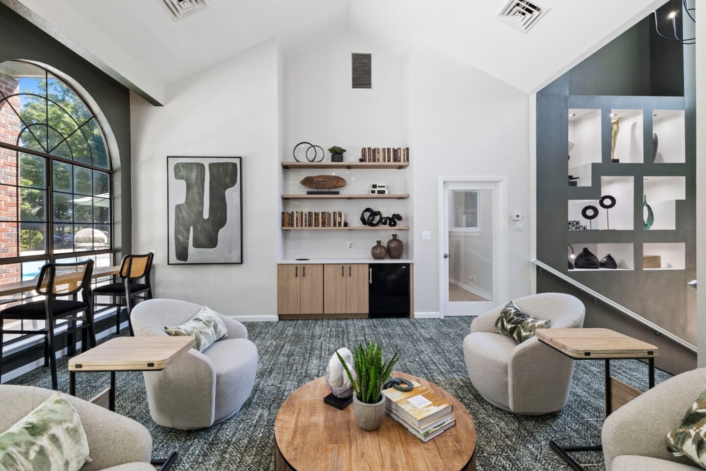 a living room with couches and chairs and a table