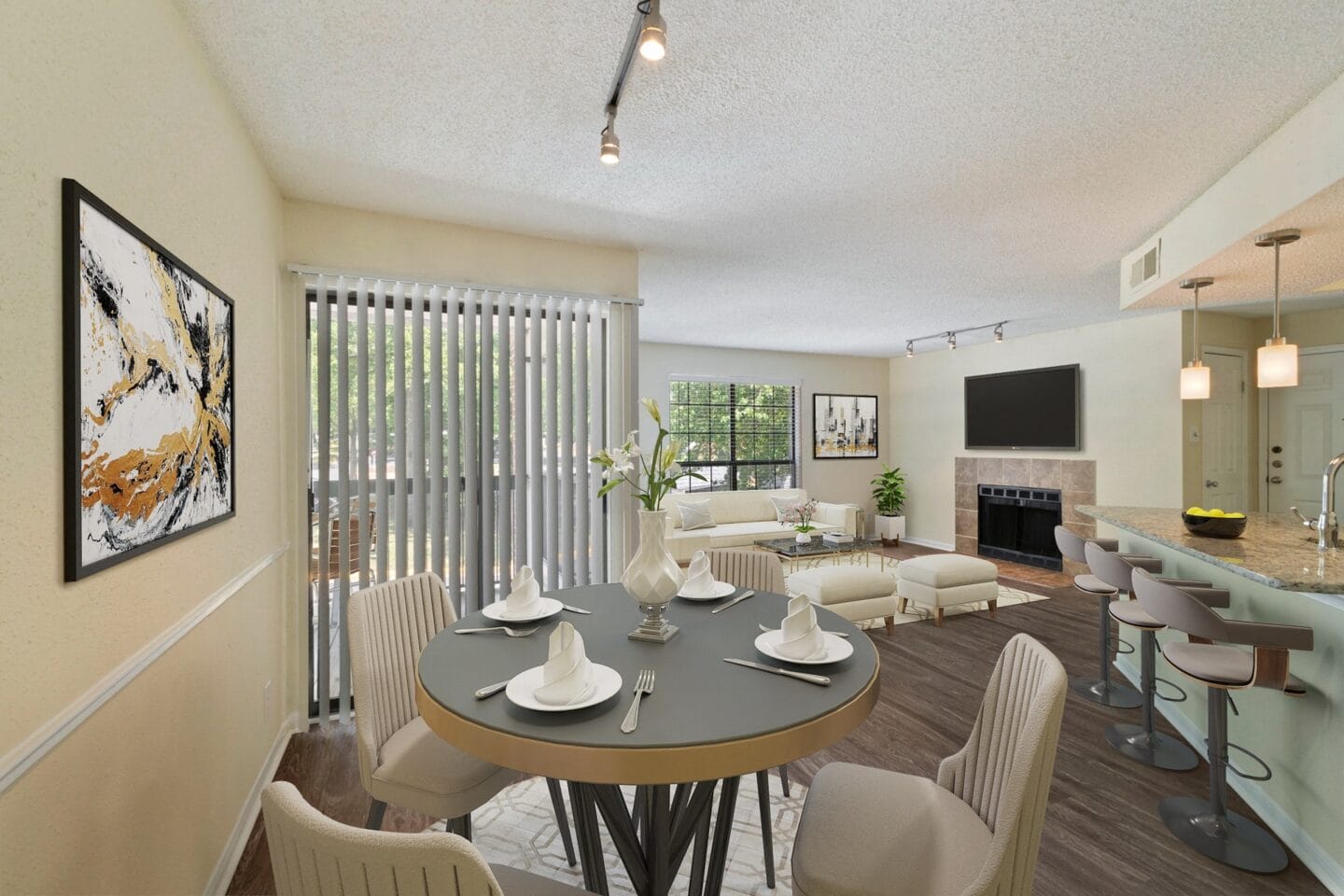 a living room and dining room with a table and chairs