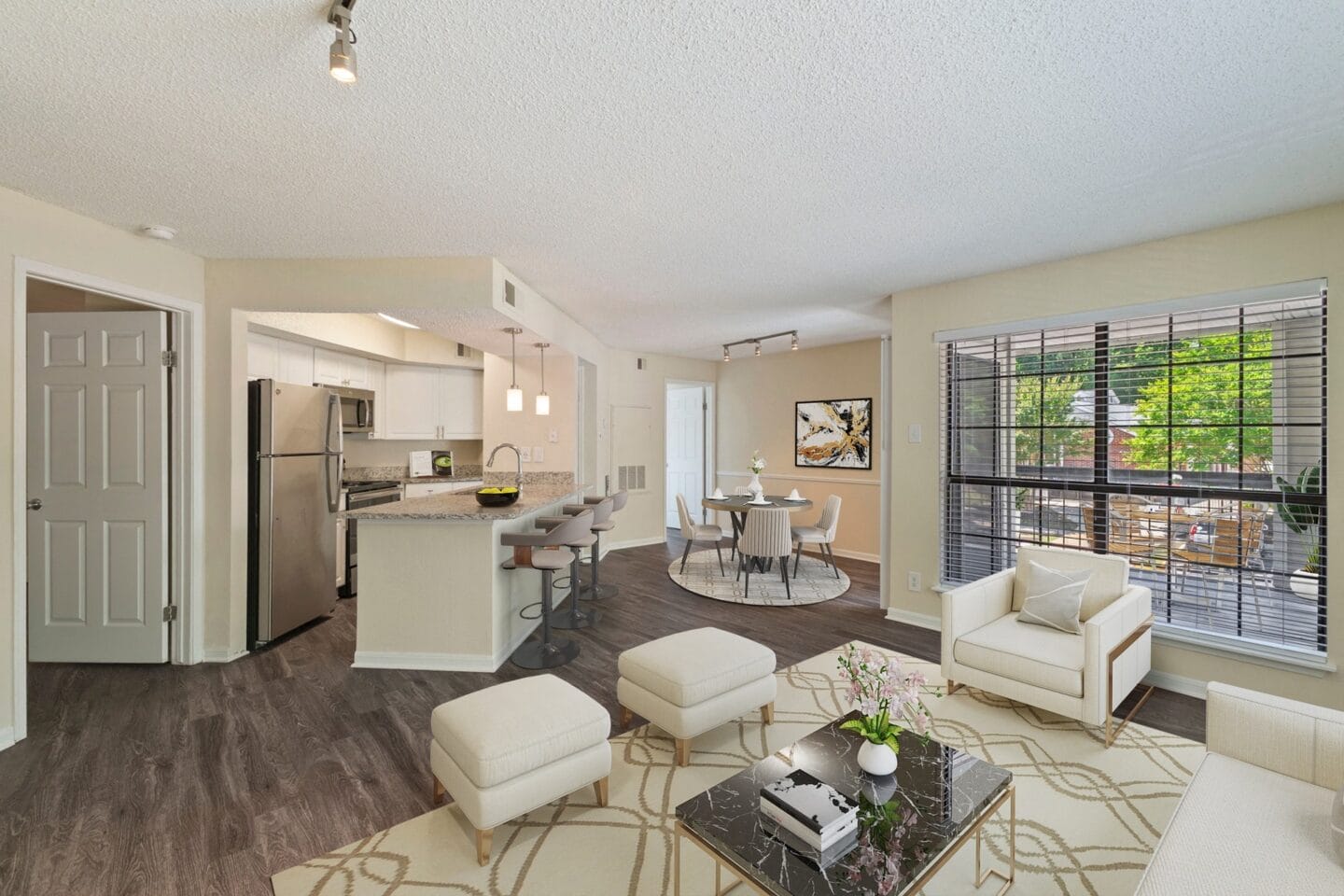 a living room with a kitchen and a dining room