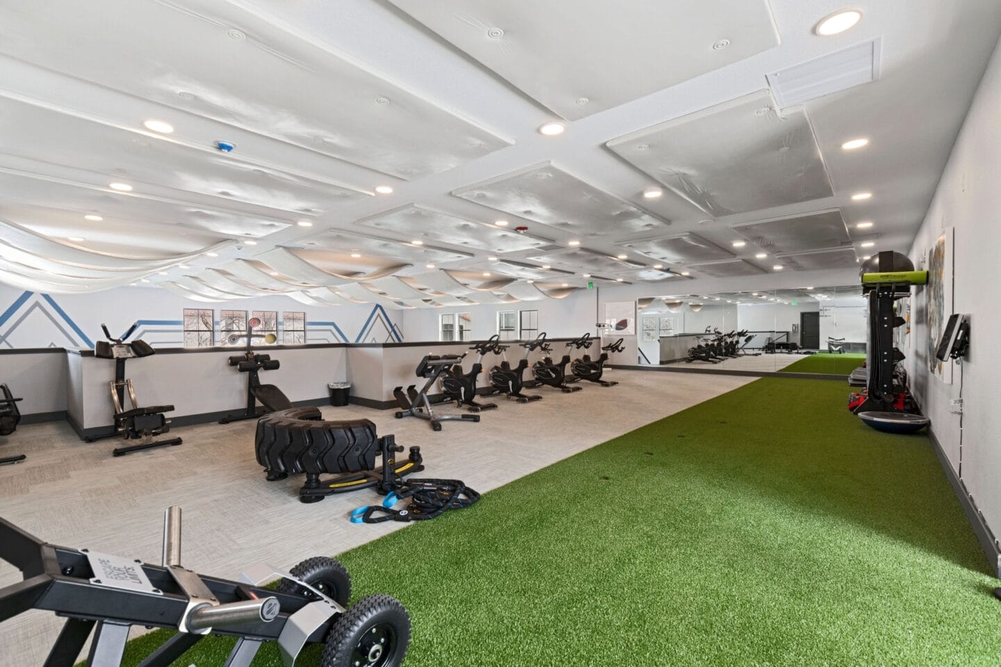 Gym with exercise equipment and a green carpet at Windsor Westminster, Westminster, Colorado