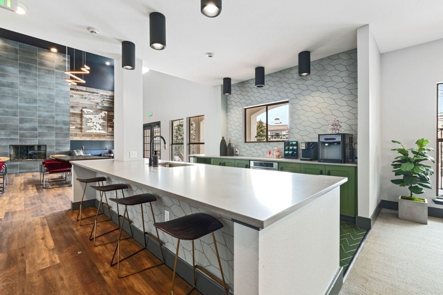 Kitchen with a large white counter top and chairs at Windsor Westminster, Westminster, Colorado