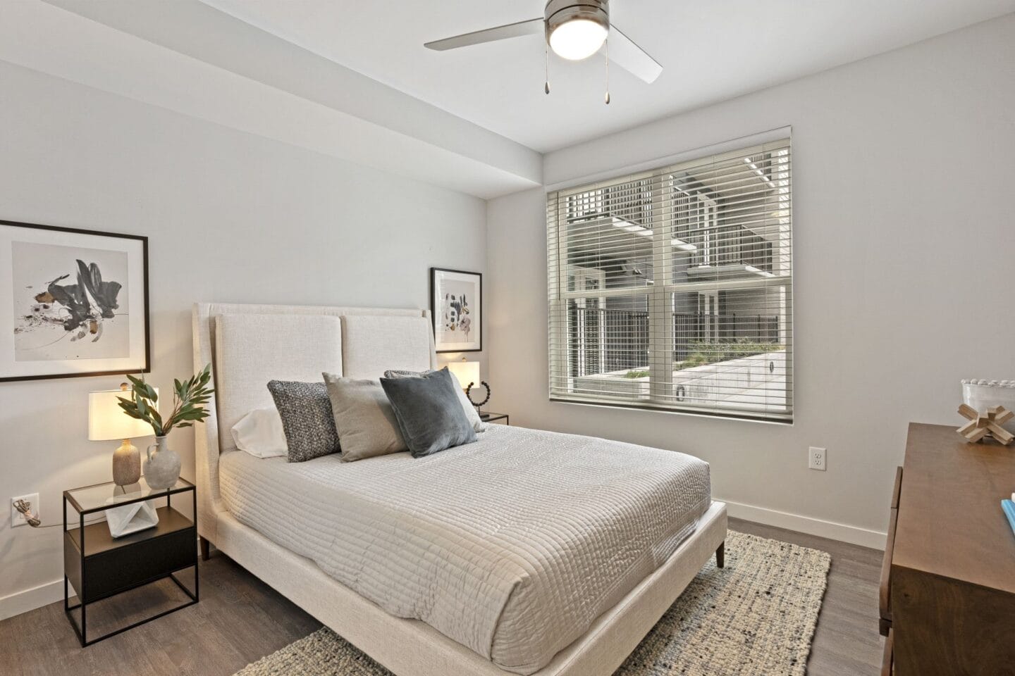 a bedroom with a large bed and a window