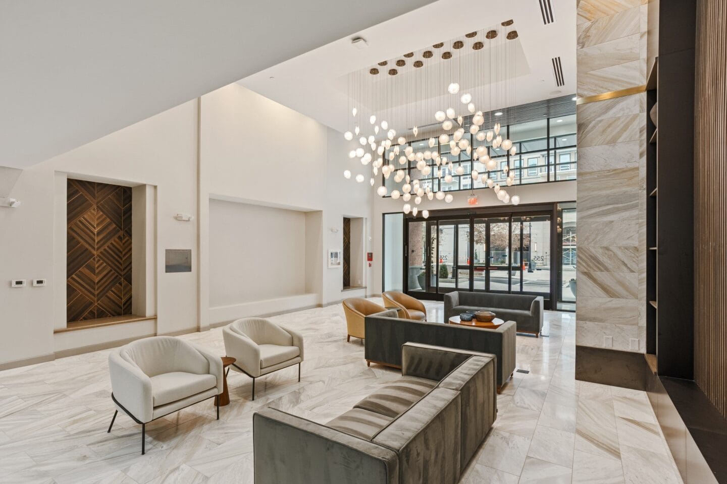 a lobby with couches chairs and a reception desk