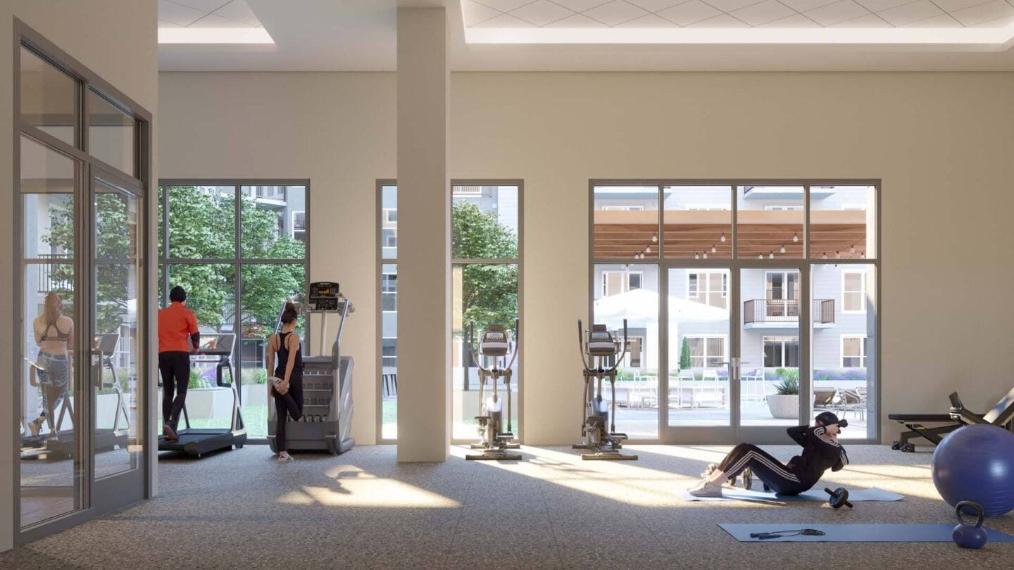 a large gym with people working out in it