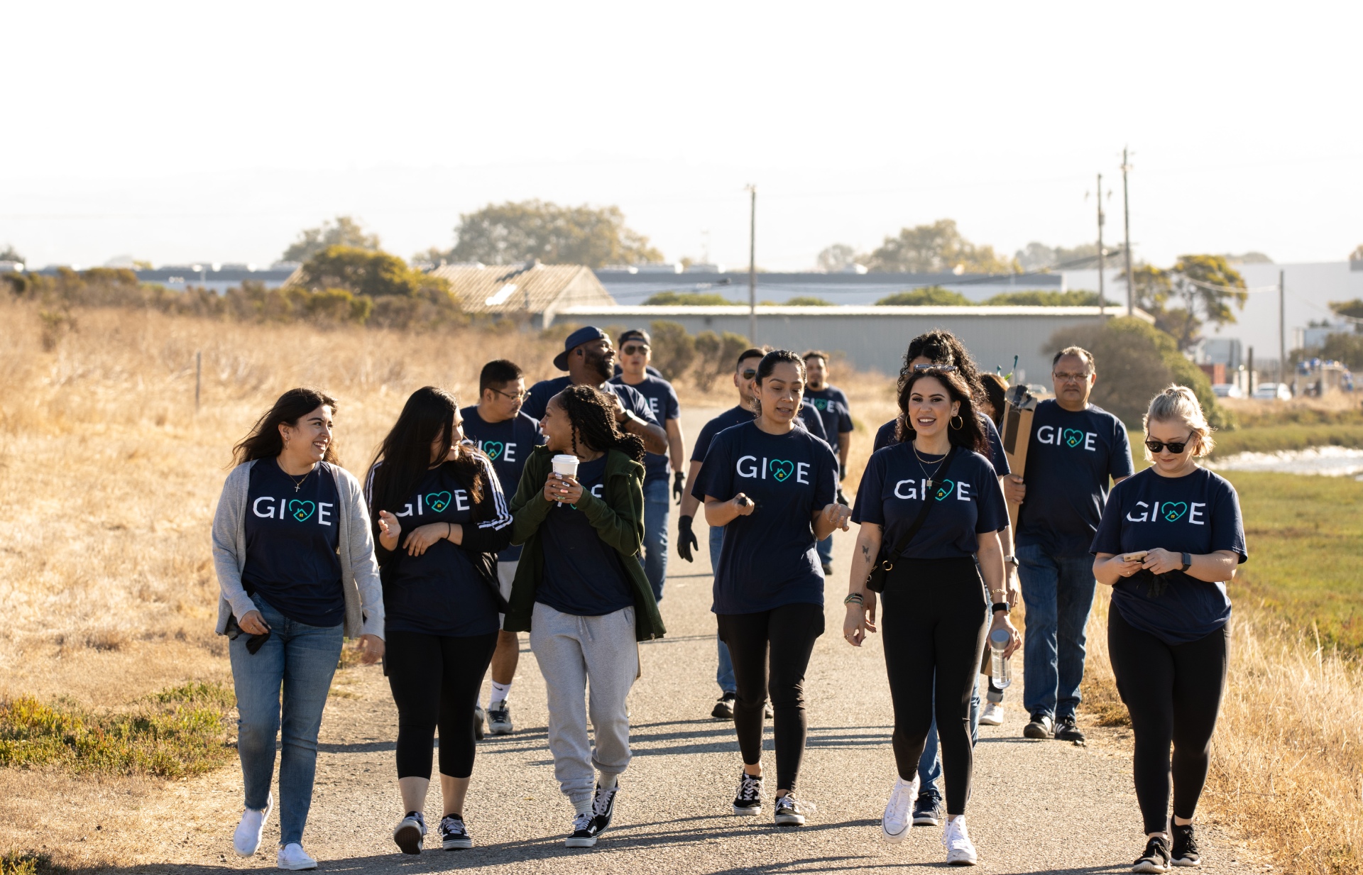 a group of people walking on a road