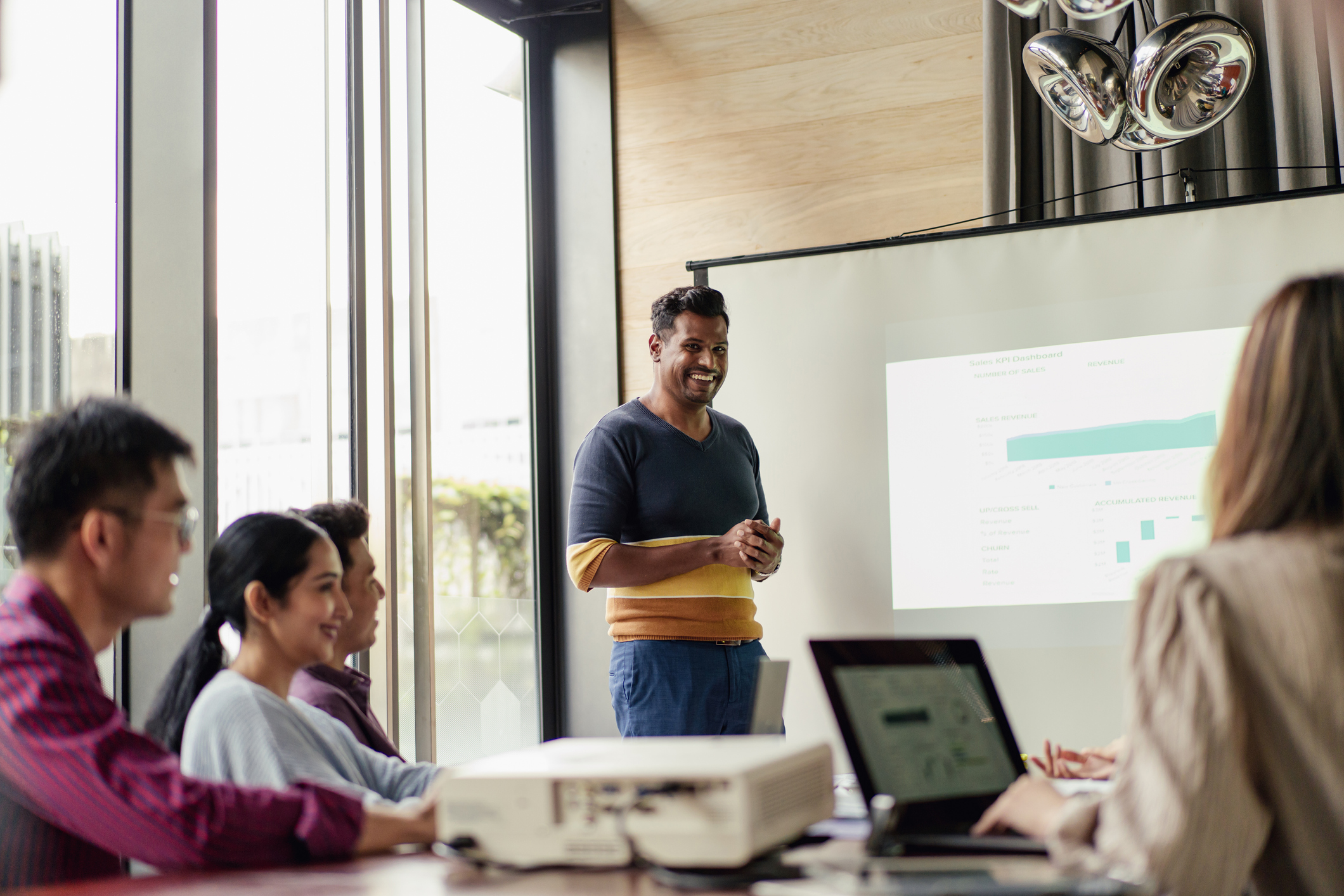 A person delivering a presentation to an engaged audience