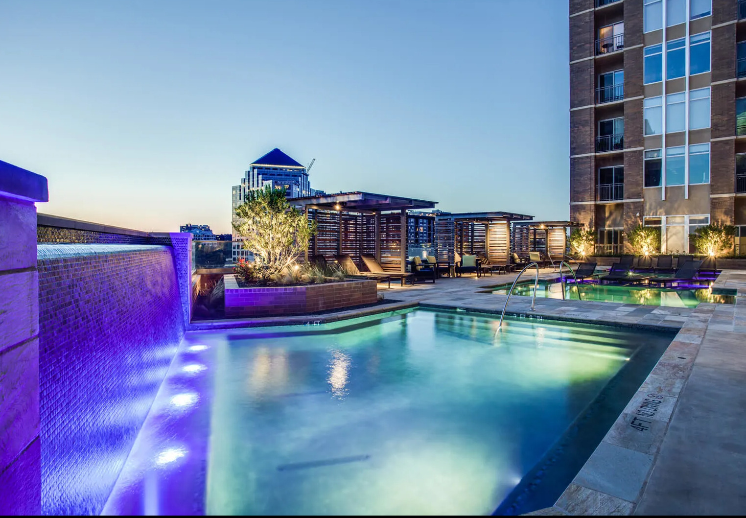 a pool with a building in the background