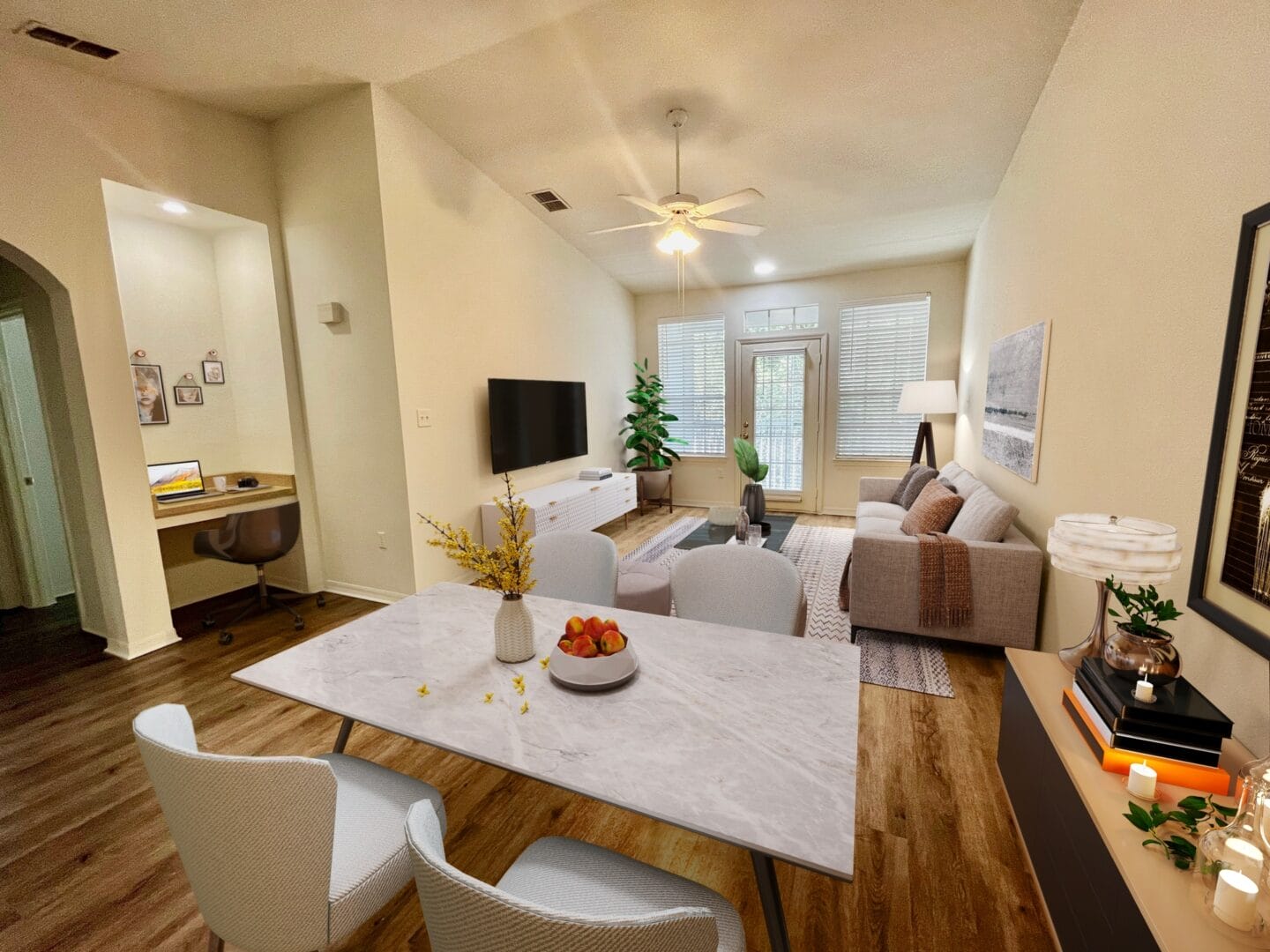 an open living room and dining room with a white table and chairs