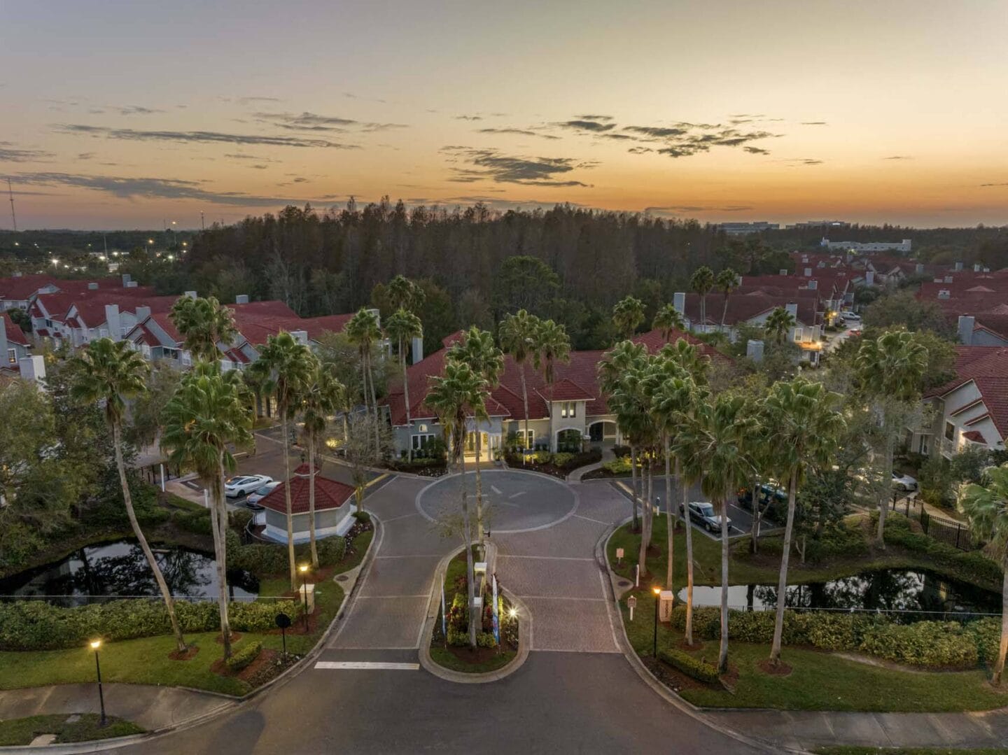 an aerial view of the neighborhood at sunset