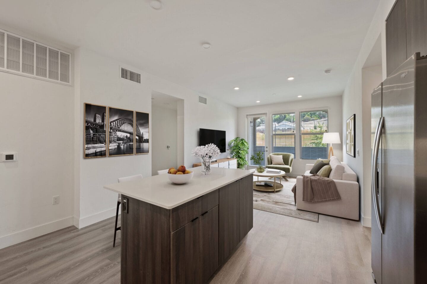 a kitchen and living room in a new home