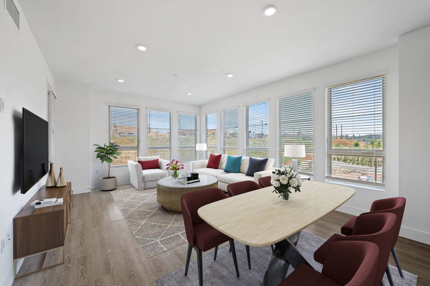 a living room with a couch and a table     and a tv