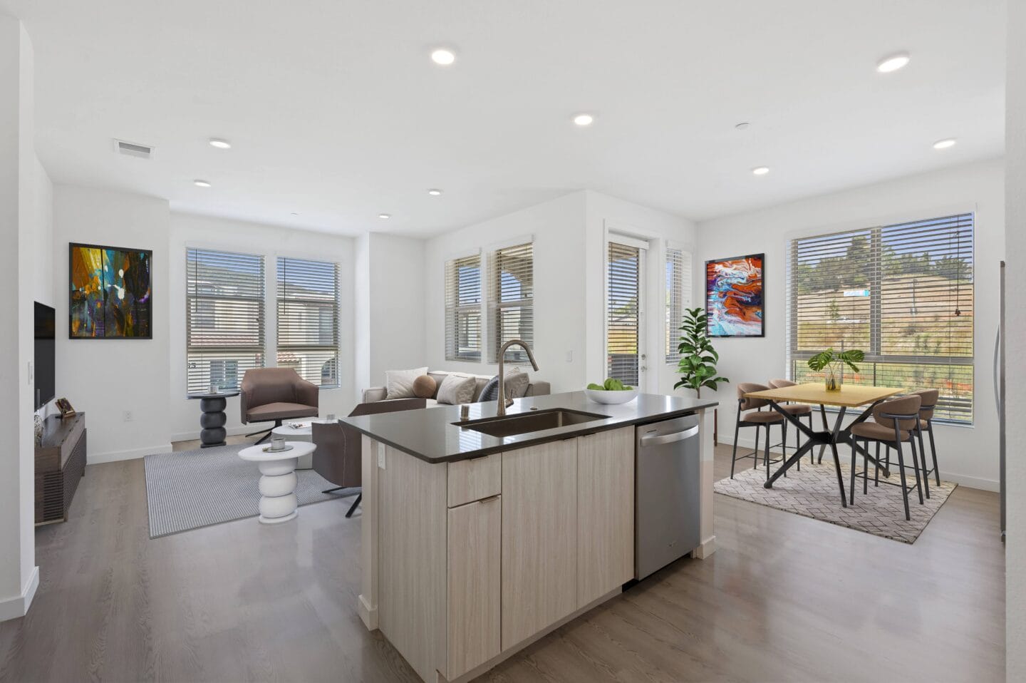 a living room with a kitchen and a dining room