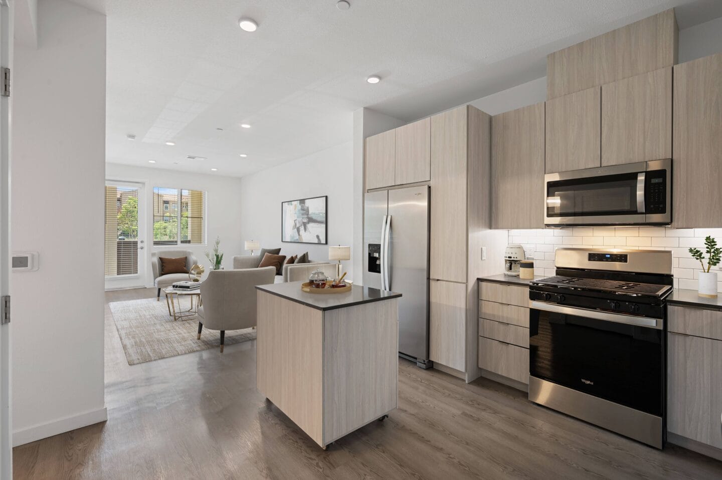 a living room with a kitchen and a dining room