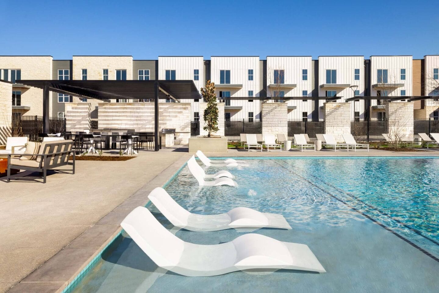 Pool with Lounge Chairs at Windsor West Plano Apartments, Plano , 75023