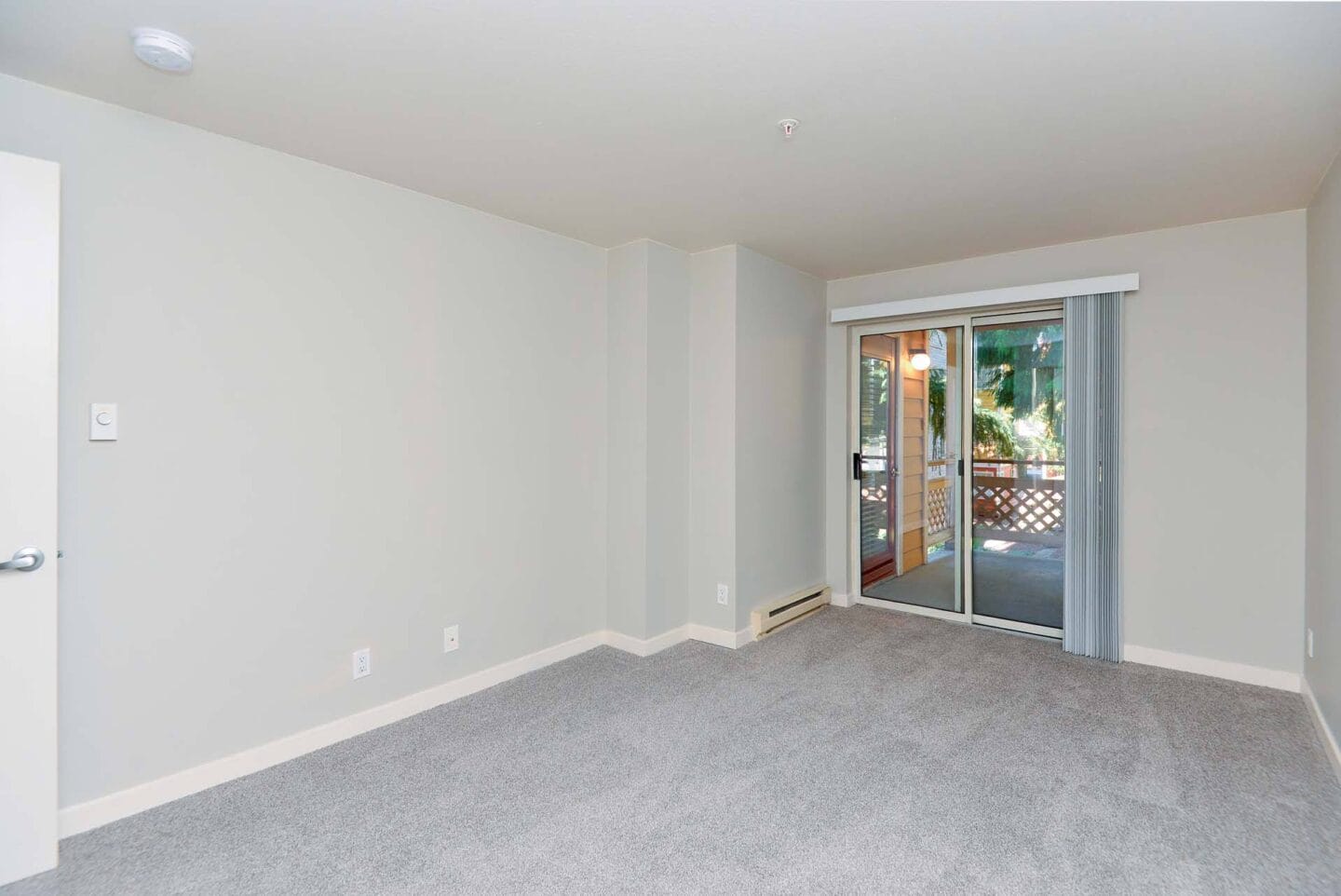 Living Room with Balcony at Windsor Juanita Bay Apartments in Kirkland, 98034