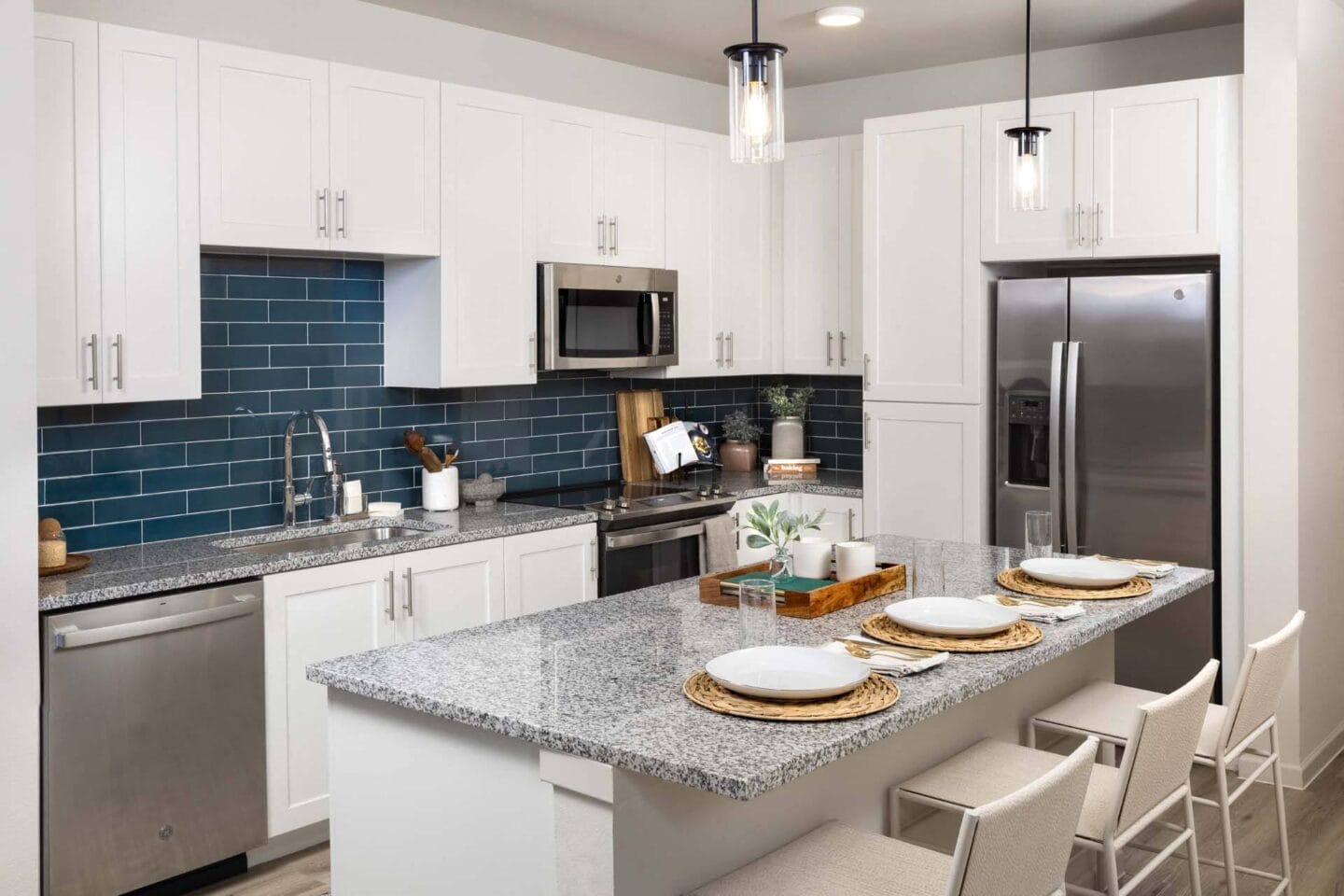 Kitchen with Island and Breakfast Bar at Windsor West Plano Apartments, Plano