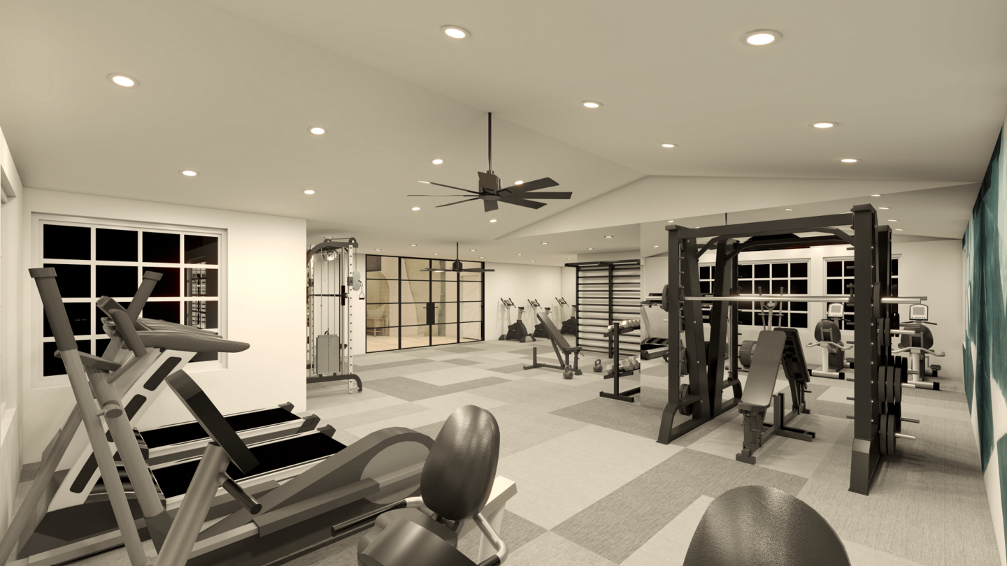 A black and white image of a gym with various exercise equipment.