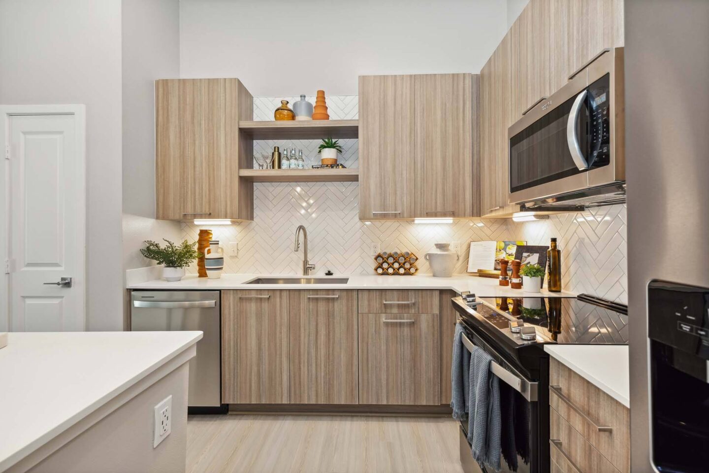 Kitchen with teak wood cabinets at Windsor Cleartwater, Clearwater, FL 33763