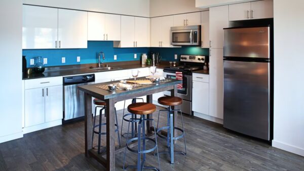 a kitchen with a island with three stools