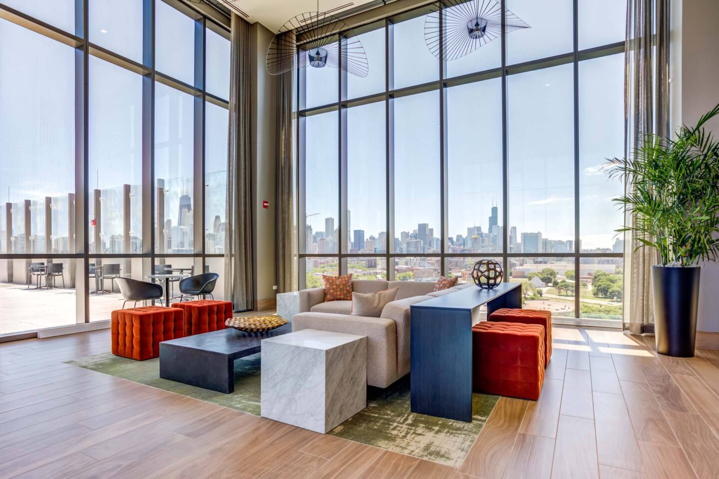 A lounge with a view of the city skyline at Windsor North + Vine 633 W North Ave, Chicago, IL 60610.