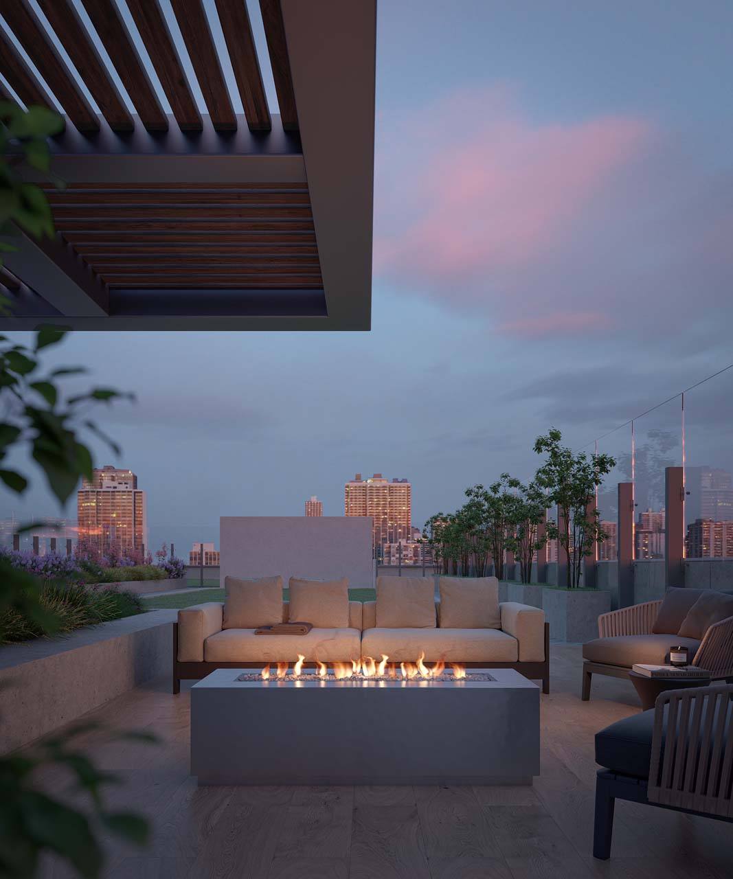 A patio with a fire pit and seating area overlooking a city skyline at dusk at Windsor North + Vine 633 W North Ave, Chicago, IL 60610.