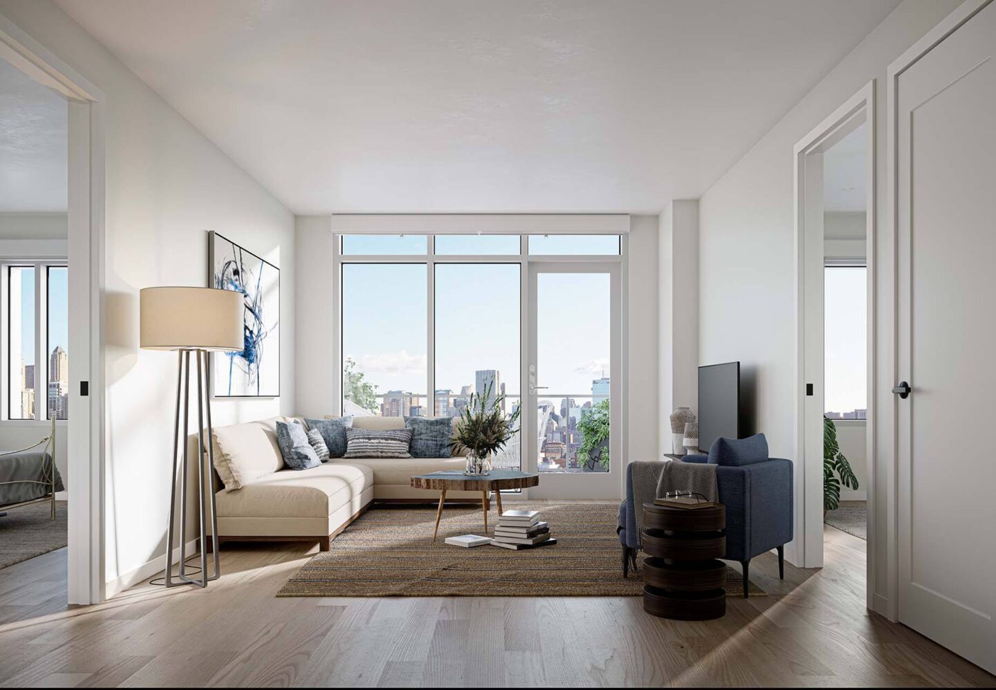 A modern living room with a large window overlooking the city at Windsor North + Vine 633 W North Ave, Chicago, IL 60610..