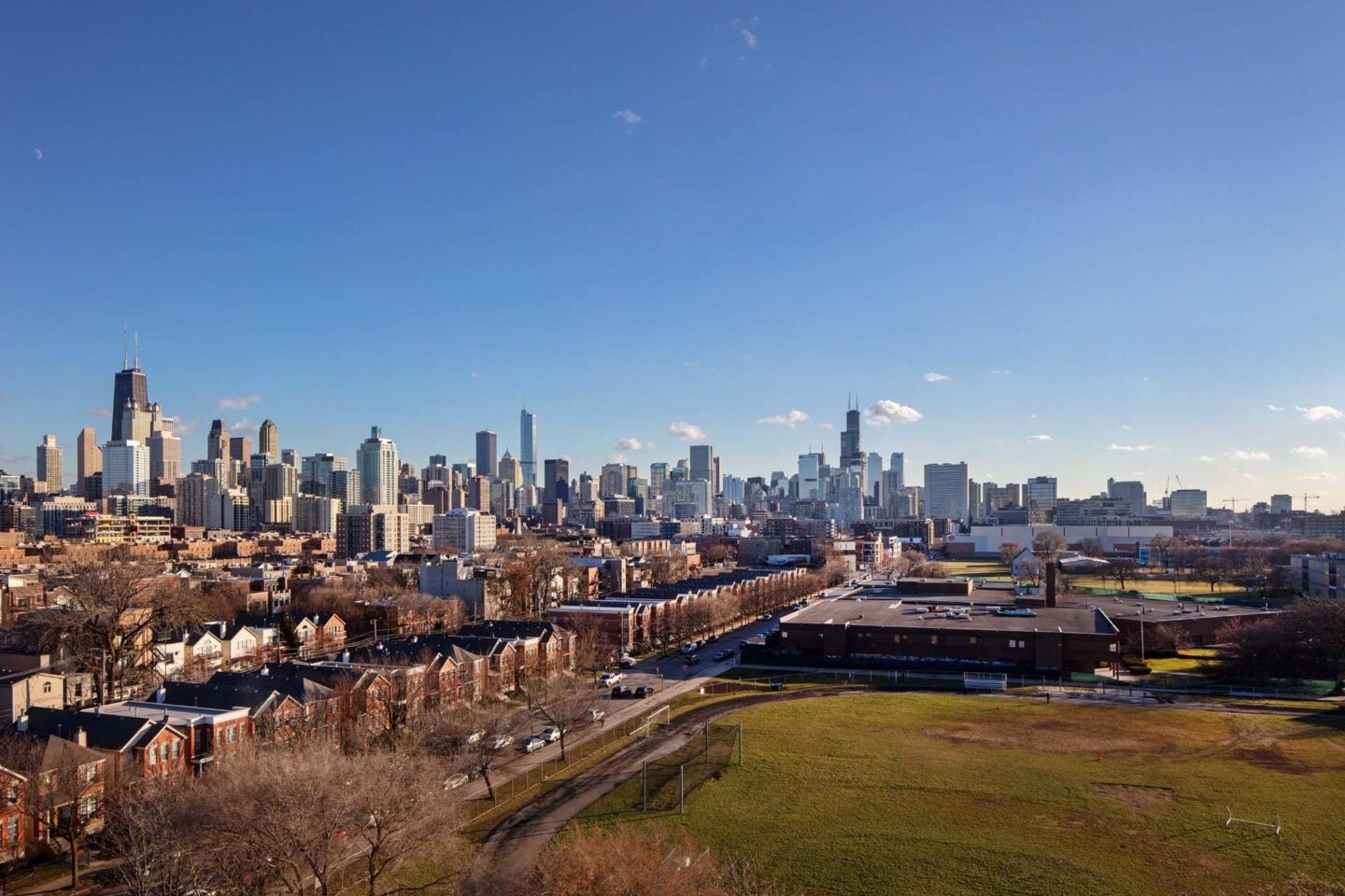 A cityscape with a clear blue sky above it at Windsor North + Vine 633 W North Ave, Chicago, IL 60610.