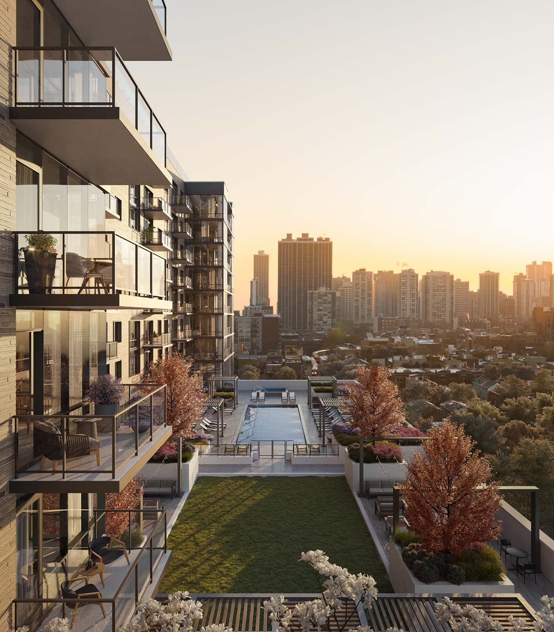 A modern apartment complex with a pool and a view of the city skyline at sunset at Windsor North + Vine 633 W North Ave, Chicago, IL 60610.