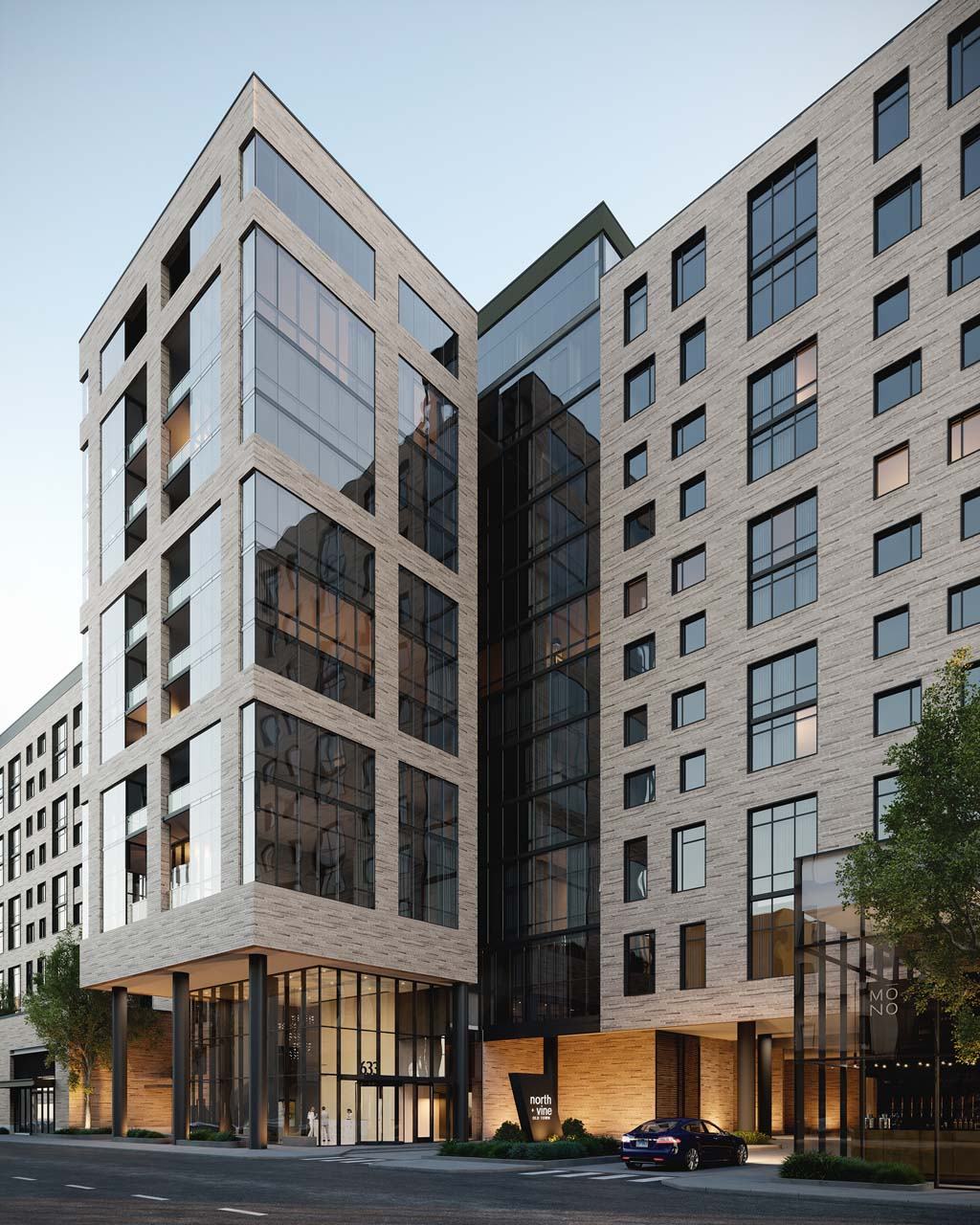 A modern building with a mix of glass and stone facade stands tall at Windsor North + Vine 633 W North Ave, Chicago, IL 60610.