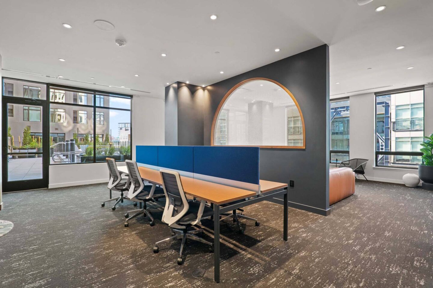 A conference room with a long table and chairs at Windsor 3000 Huron, 3000. N. Huron Street, Denver, CO 80202.