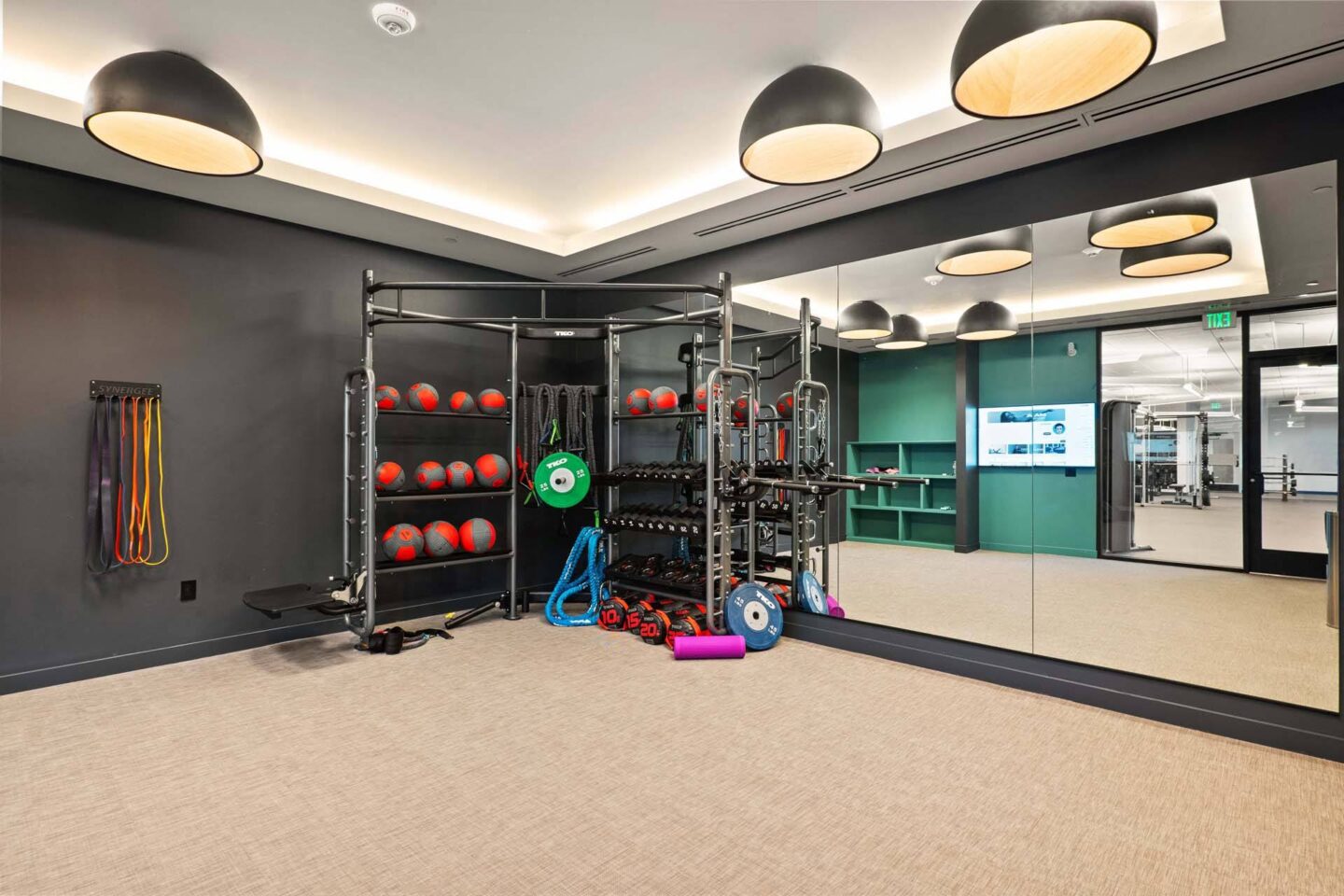 A gym with a variety of equipment including a rack of medicine balls at Windsor 3000 Huron, 3000. N. Huron Street, Denver, CO 80202.