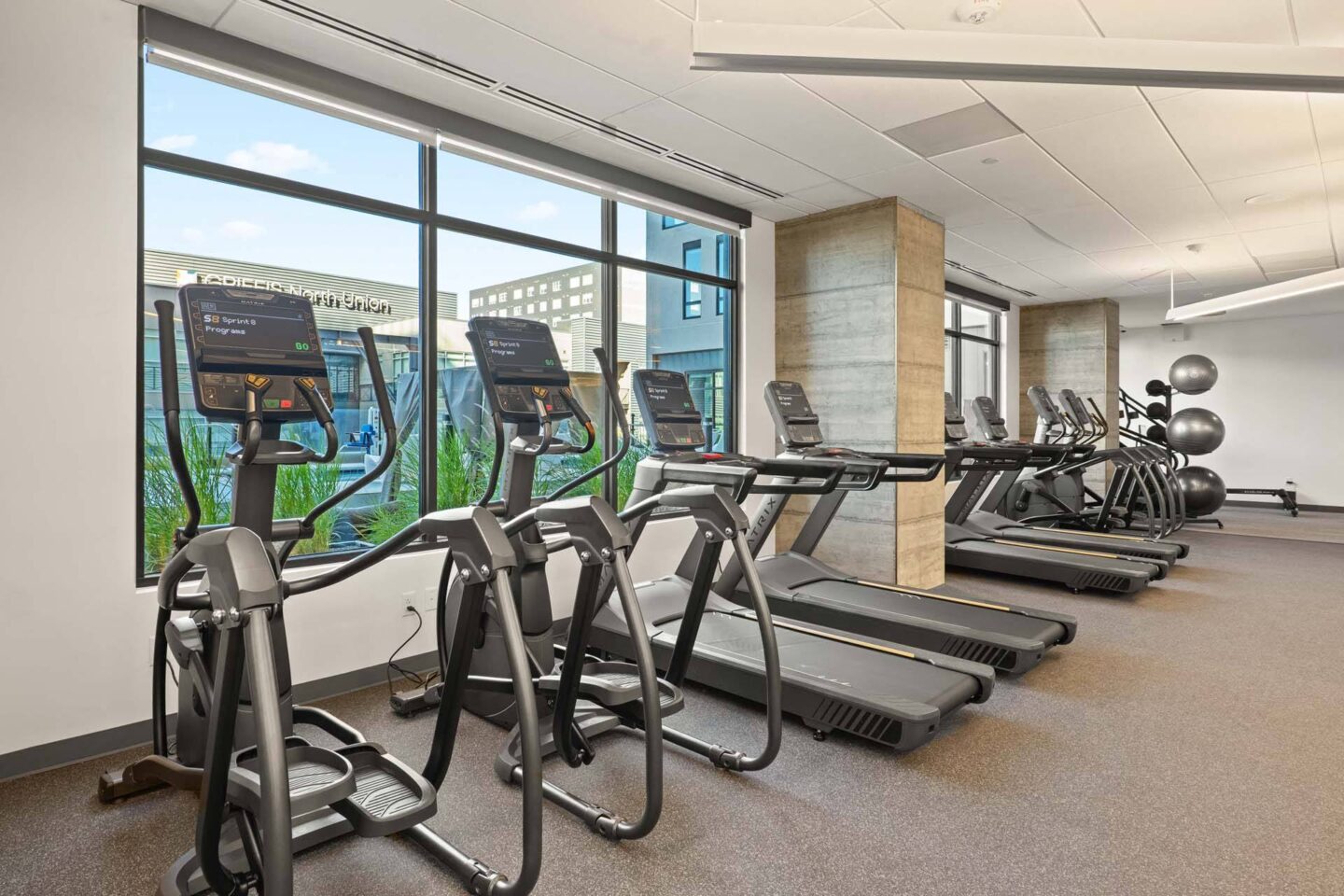 A gym with treadmills and elliptical machines at Windsor 3000 Huron, 3000. N. Huron Street, Denver, CO 80202.