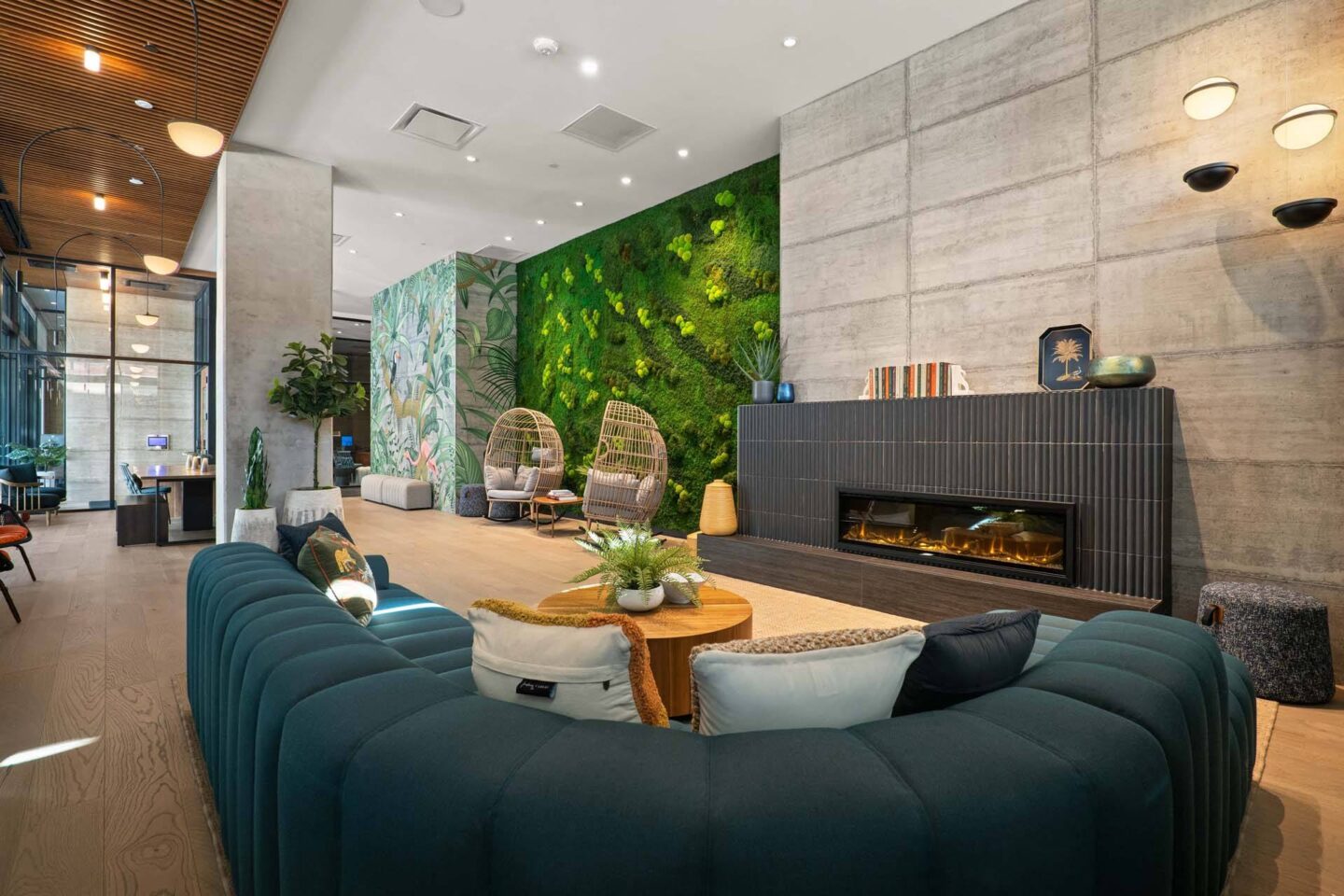 A modern lounge with a fireplace and a green wall at Windsor 3000 Huron, 3000. N. Huron Street, Denver, CO 80202.