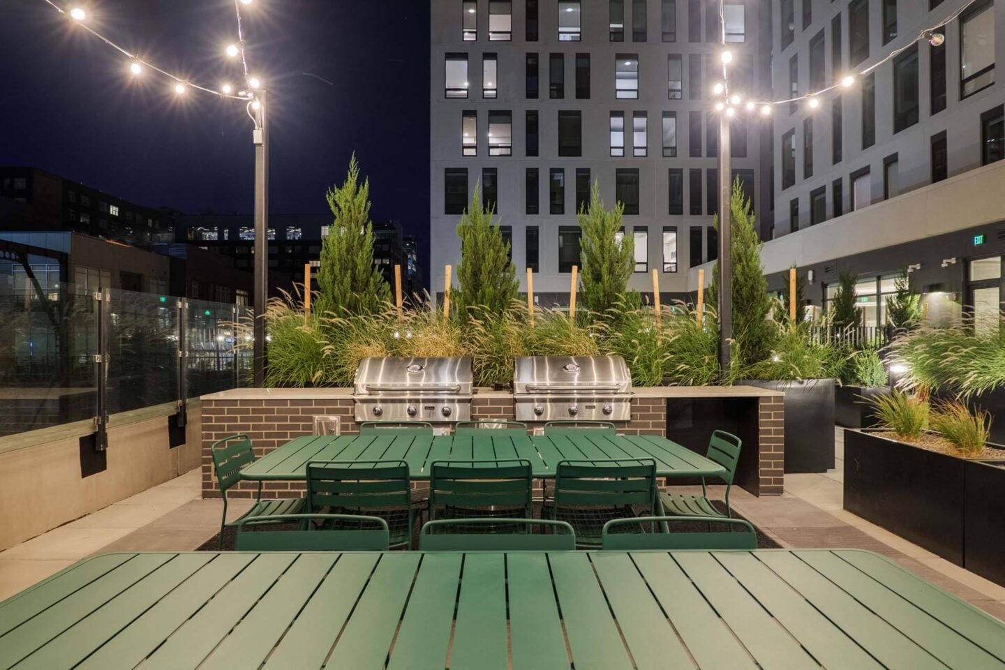 A green table set up on a patio at Windsor 3000 Huron, 3000. N. Huron Street, Denver, CO 80202.