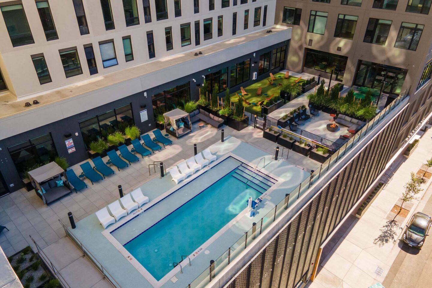 A swimming pool and outdoor patio lounge at Windsor 3000 Huron, 3000. N. Huron Street, Denver, CO 80202.