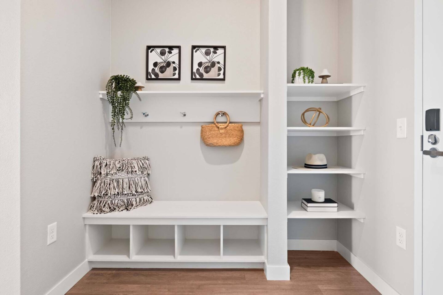 An entryway with a white bench and shelves at Windsor 3000 Huron, 3000. N. Huron Street, Denver, CO 80202.