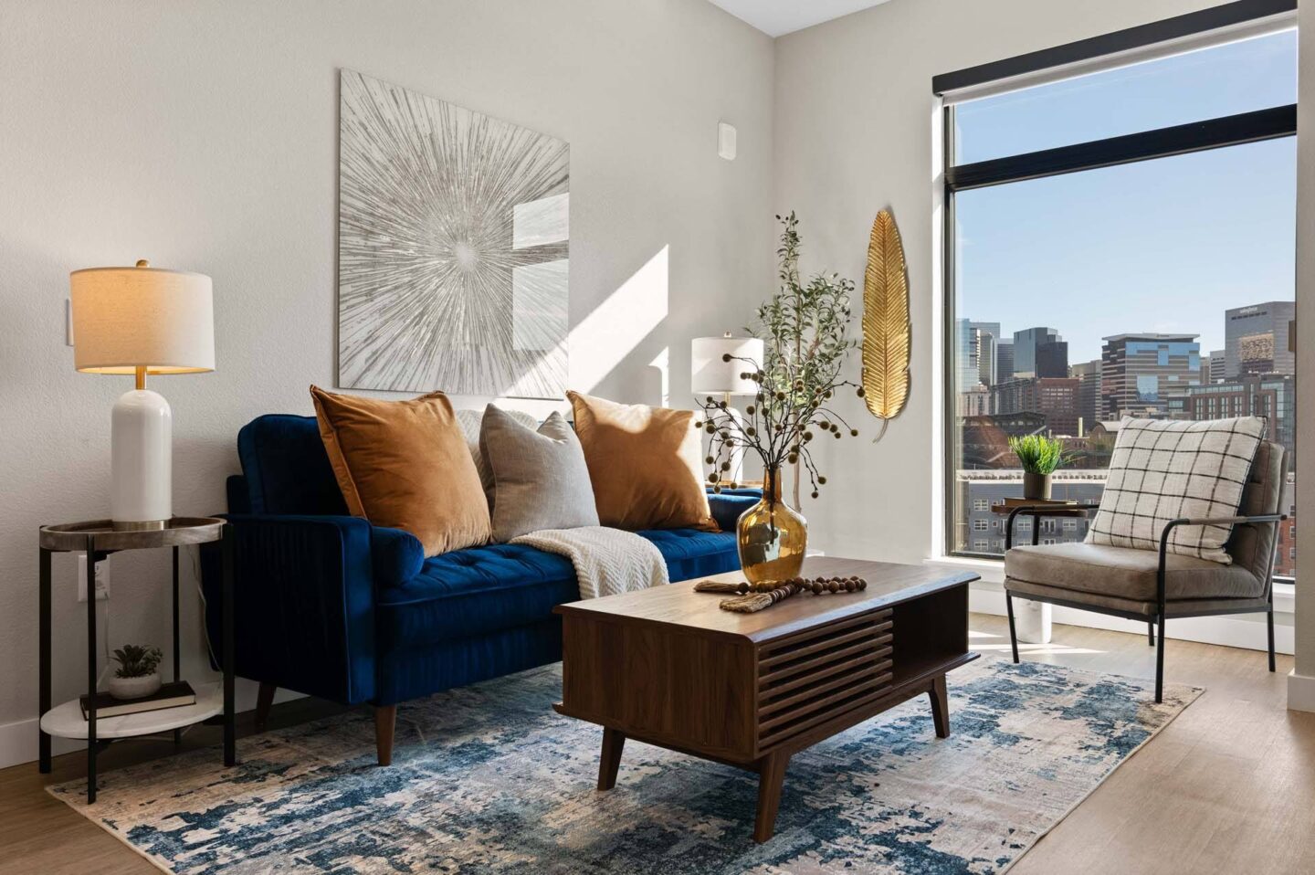 A living room with a view of the city at Windsor 3000 Huron, 3000. N. Huron Street, Denver, CO 80202.